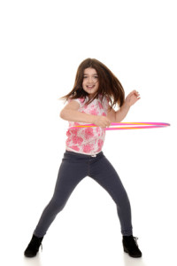 child doing hula hoop with motion blur