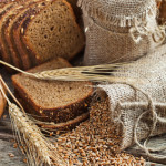 Fresh Bread And Wheat On The Wooden