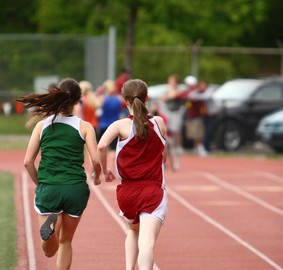 Girls running on track